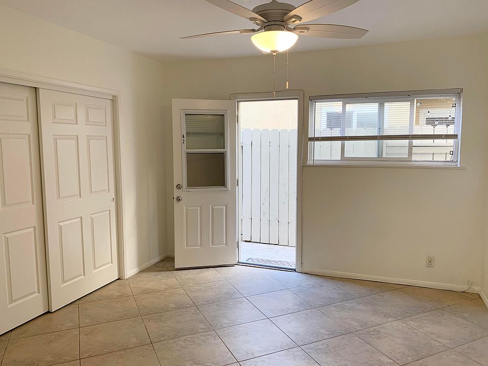 Bedroom with large closet space & new flooring throughout apartment.