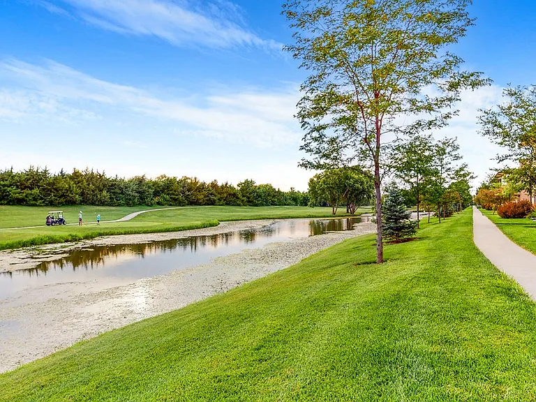 Immerse yourself in nature with serene golf course views and a peaceful walking path right outside your door.