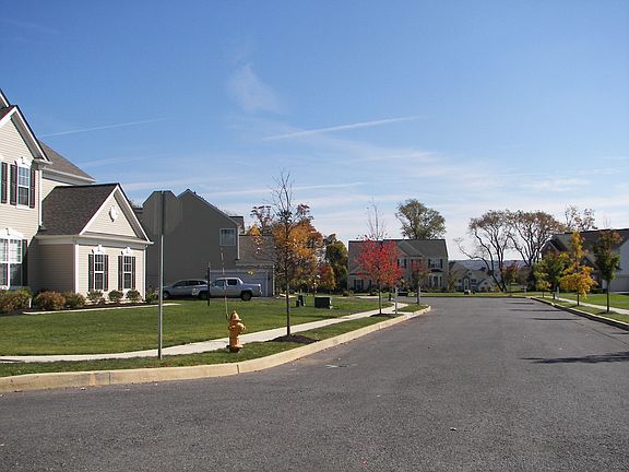 View into cul-de-sac(Home is showing on left corner)