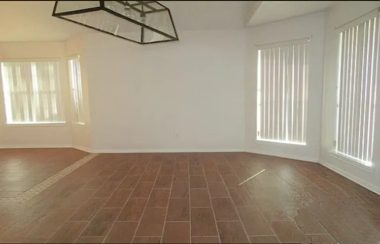 Open family room attached to dinette and kitchen.