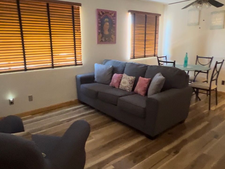 living room and dining room open concept lots of light. hardwood floors throughout