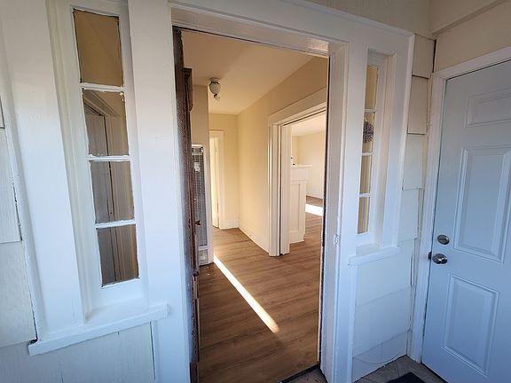 Entryway living room to the right.