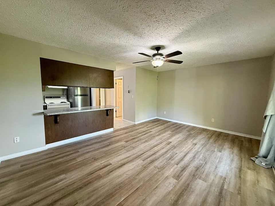 Open living area and kitchen with breakfast bar