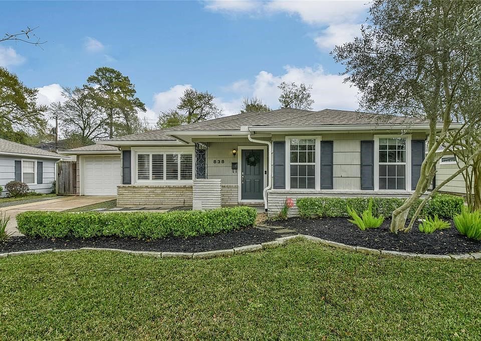 Welcome... This home sits well above street level. No Flooding here. Garage door opens to secondary parking and rear garage.