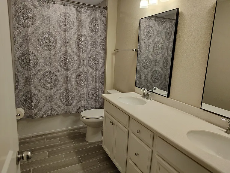 Hall bathroom shared with 3rd bedroom