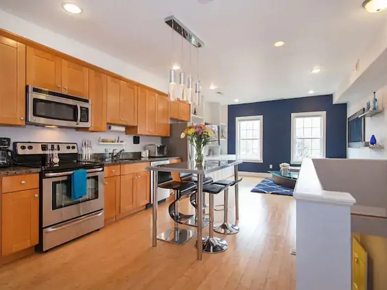 Open concept kitchen, living, dining room. Offered furnished as you see here.