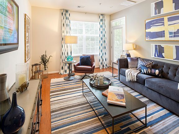 Living Room with wood-look flooring at Dwell Vienna Metro