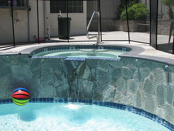 Jacuzzi waterfall into pool