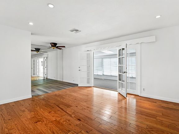 Living room view, Dining room view, and Sunroom entrance.