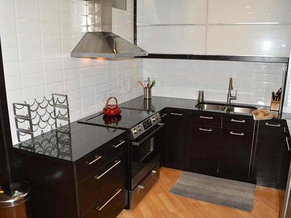 Modern kitchen with plenty cupboard space and oven and hob