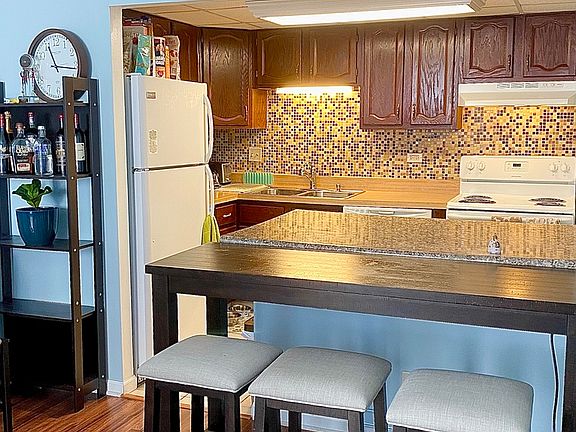 2nd image of 9078 W Heathwood Dr APT 1L
