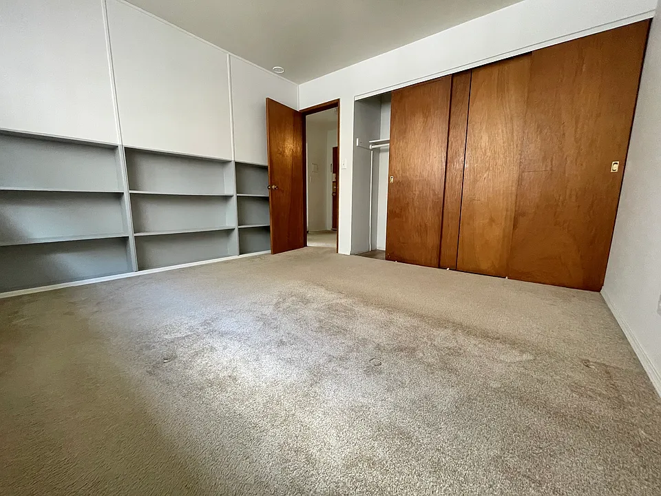 Bedroom view 1 with built-in shelving