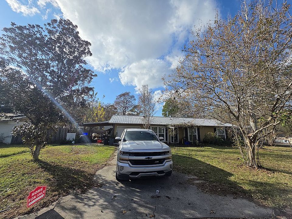 Front house view w/carport
