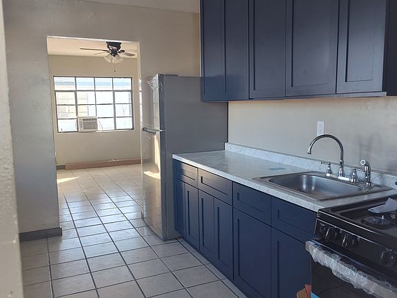 Updated Kitchen with brand new cabinets, sleek countertops, and stainless steel appliances.