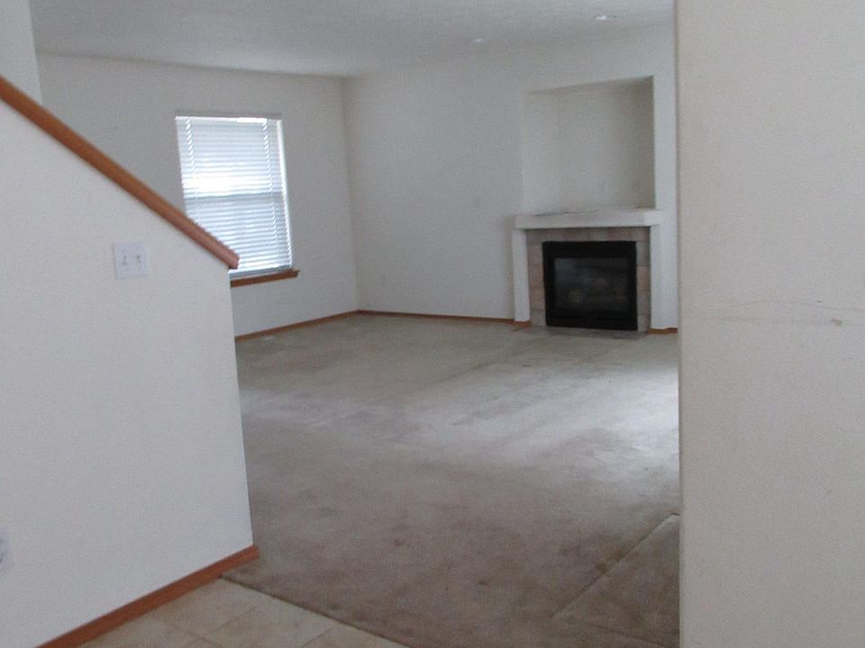Dining area into living room.  Gas fireplace and space for t