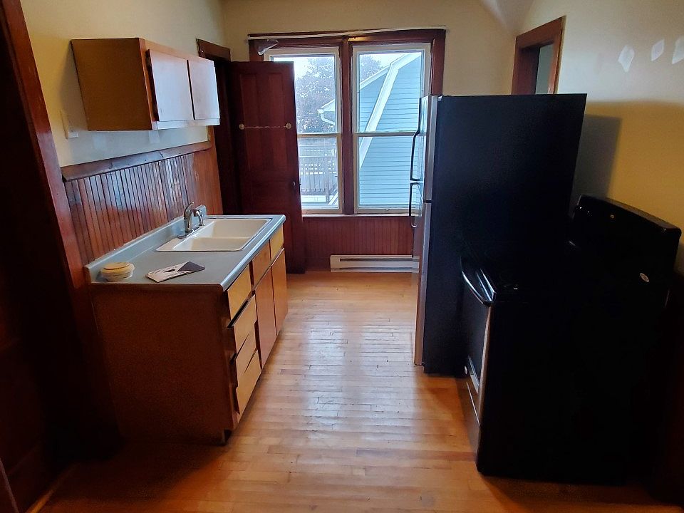 Galley kitchen with pantry on right and closet on left