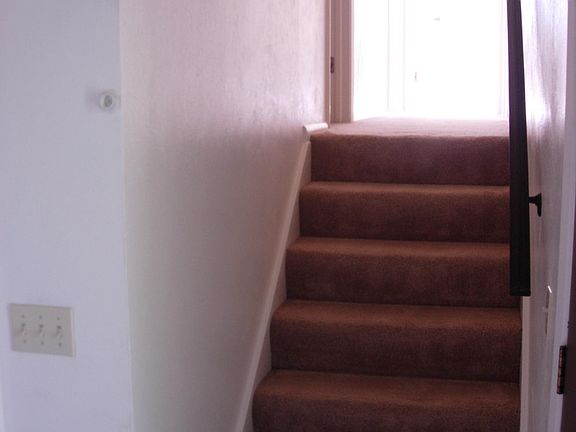 Stairs to 3 bedrooms and two baths