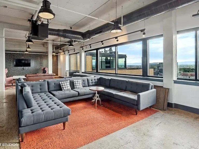 Penthouse entertainment lounge with comfortable seating at Archer Tower in Denver, CO