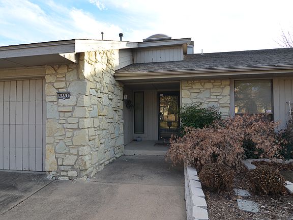 Covered entry and great landscaping