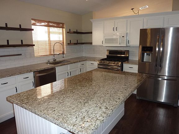 Kitchen with Granite Countertops and large island.