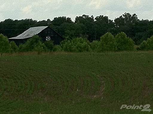 Field leading to back of barn