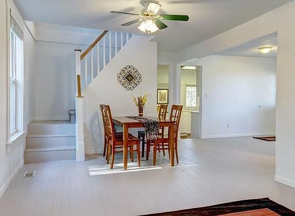 Painted wood floors throughout the dining & living room provide added charm to this lovely home.