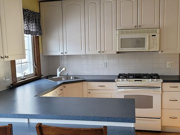 Kitchen with gas stove, microwave and dishwasher