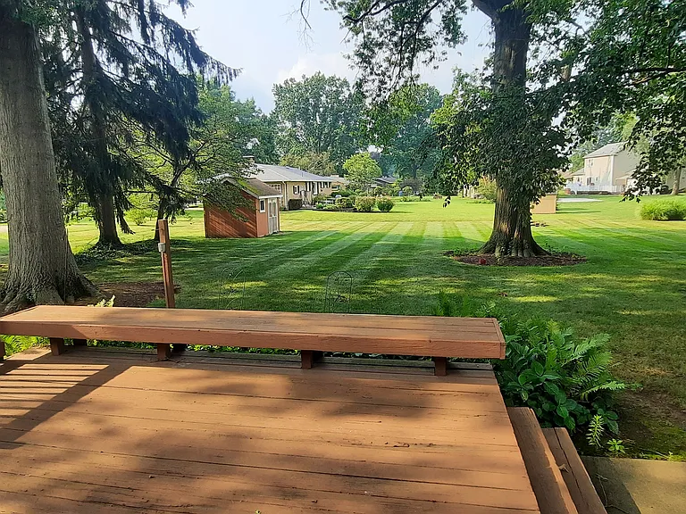 Large half acre lot with plenty of shade from the trees. Shed is handy for storage