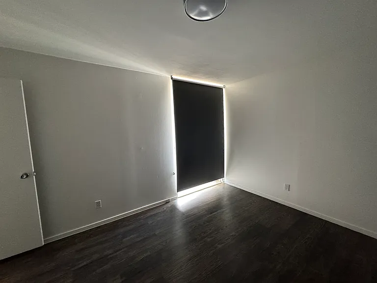 Bedroom features insulated exterior wall for year round comfort, efficient LED lighting, new blackout roller shade, and a walk-in closet.
