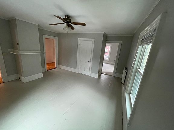 Another view of the living room. on the left can see doorway to the entranceway hall, closet and doorway to front bedroom.