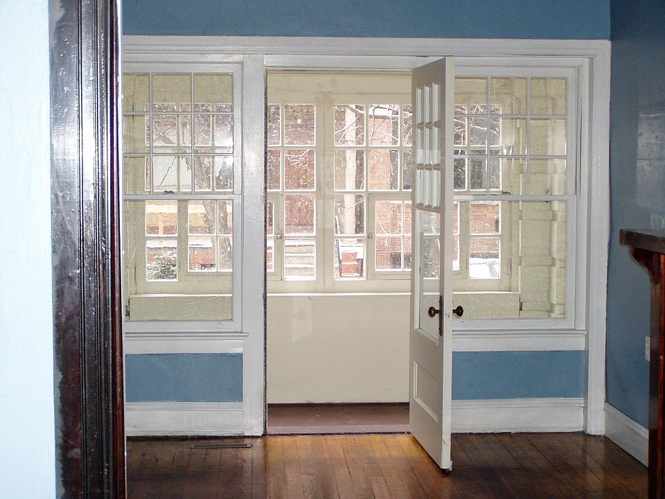 view from living room to sunroom thru to the street