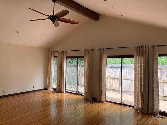Vaulted living room, opens to deck