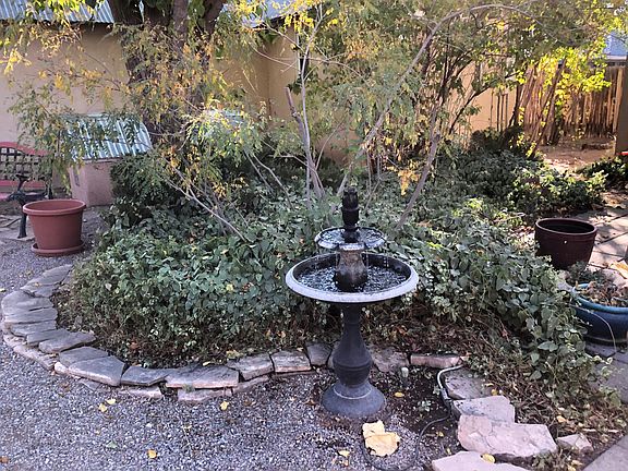 fountain and plantings in the compound garden