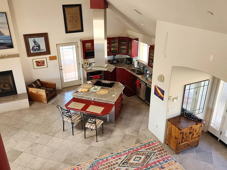 The entrance, foyer, and kitchen (and part of the living area) from the top of the spiral staircase.