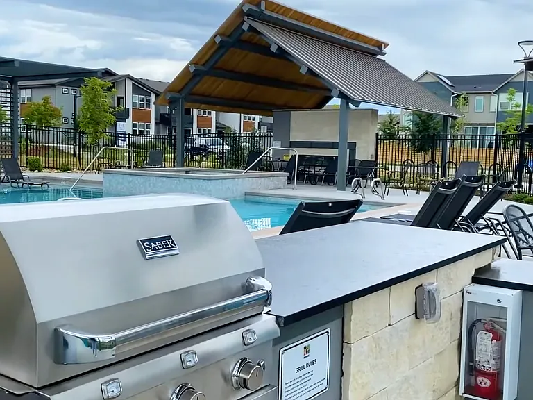 1 of 2 community pools. This one has the tanning ledge, hot tub, and stainless steel gas grill