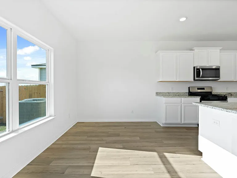 The dining room with vinyl flooring.