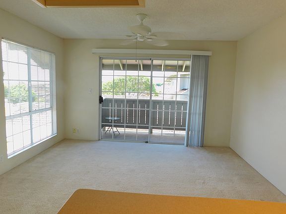 From kitchen, through living/dining, to covered lanai; ceiling fan