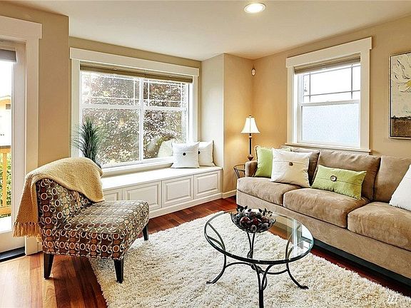 living room with storage in window seat