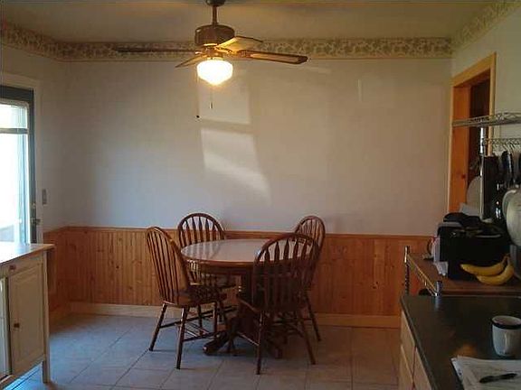 Dining area of the kitchen with wainscoting wall treatment