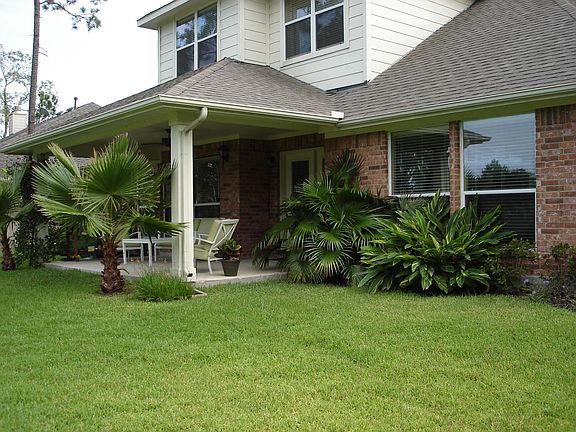 The rear of the home and large covered patio - an outdoor living room!