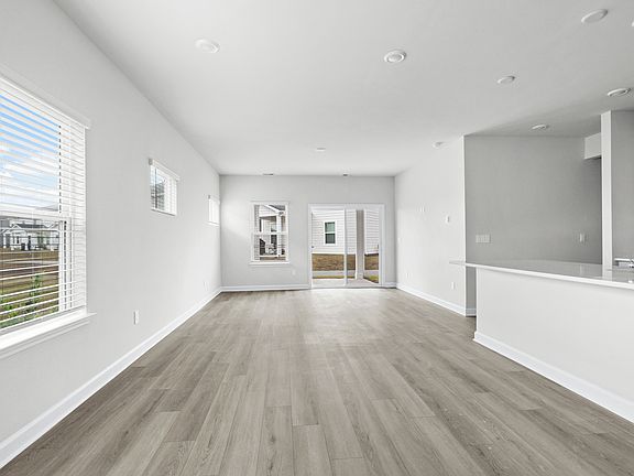 The open-concept living space is accentuated with plenty of natural light.