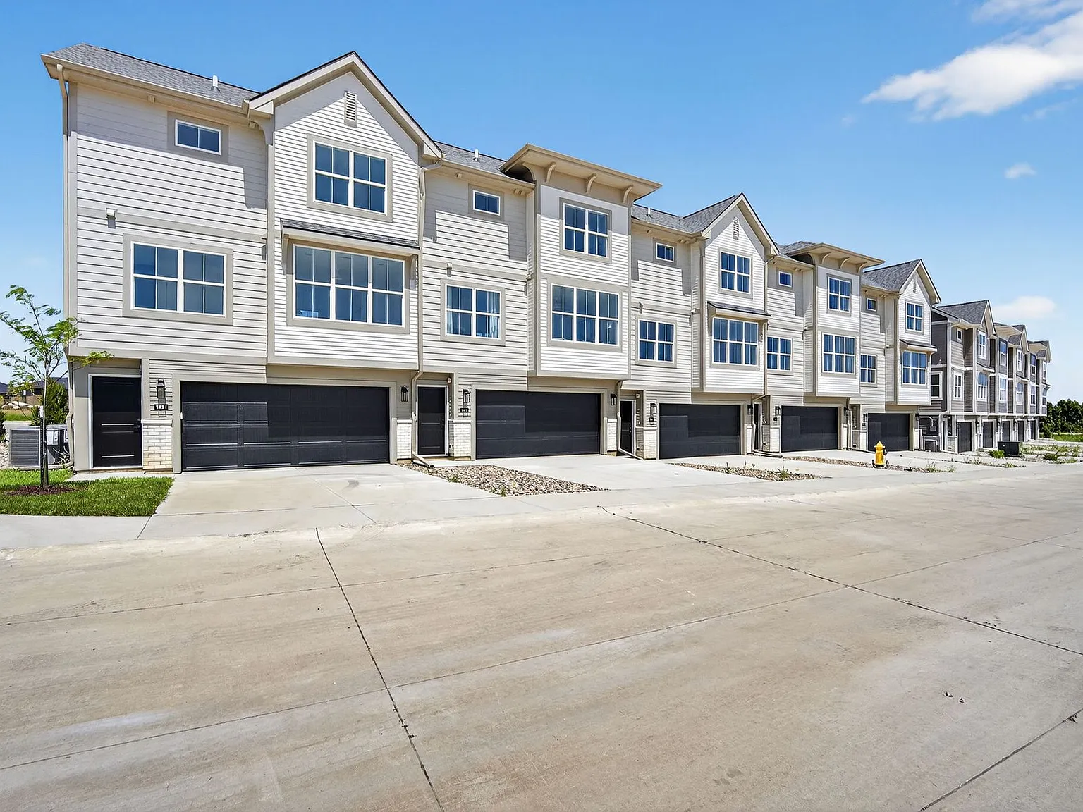 Luxury Townhomes in Waukee's Kettlestone District | Attached 2-Car Garage — Photo 3
