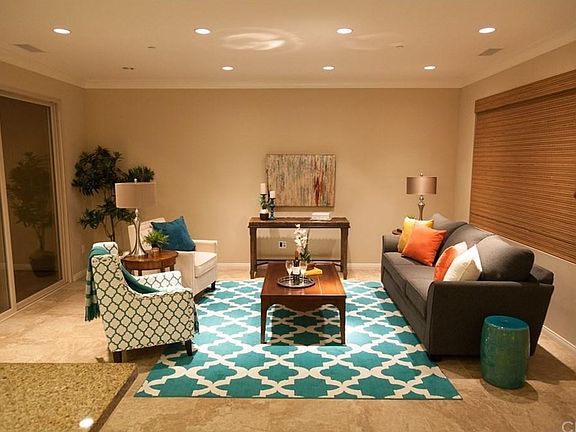 Open concept living area downstairs. Private open air atrium through sliding door on left.