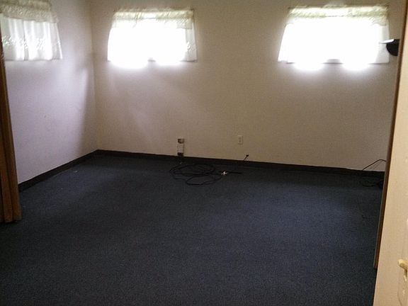 One end of large room ( Living room ) conferance area. 15'wi