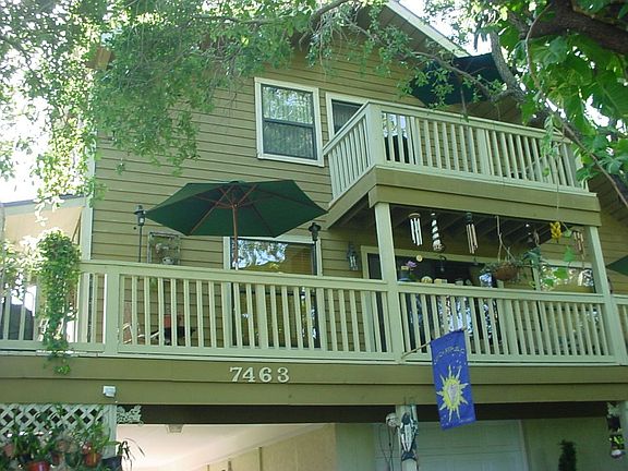 Front faces West W/Wrap around deck to back yard