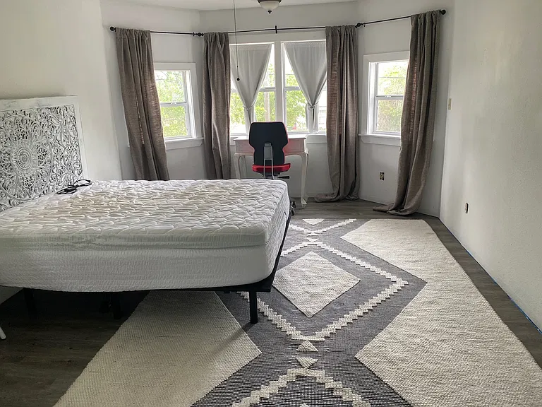 Primary bedroom comes with bed
