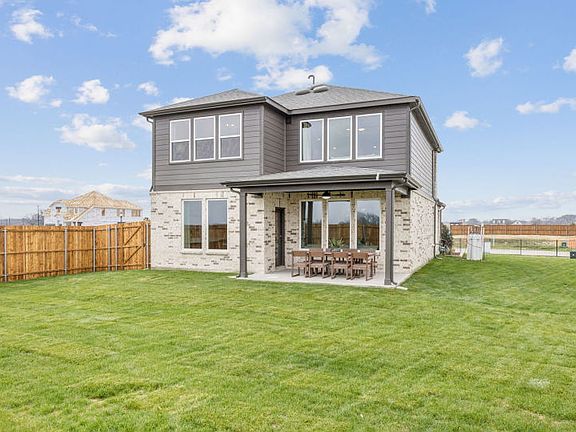 Spacious backyard with covered patio