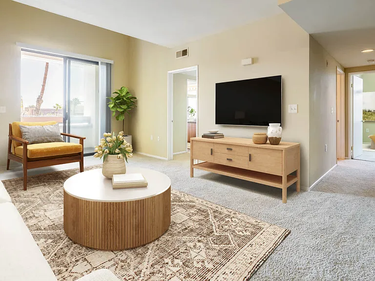 Carpeted Living Room with Balcony