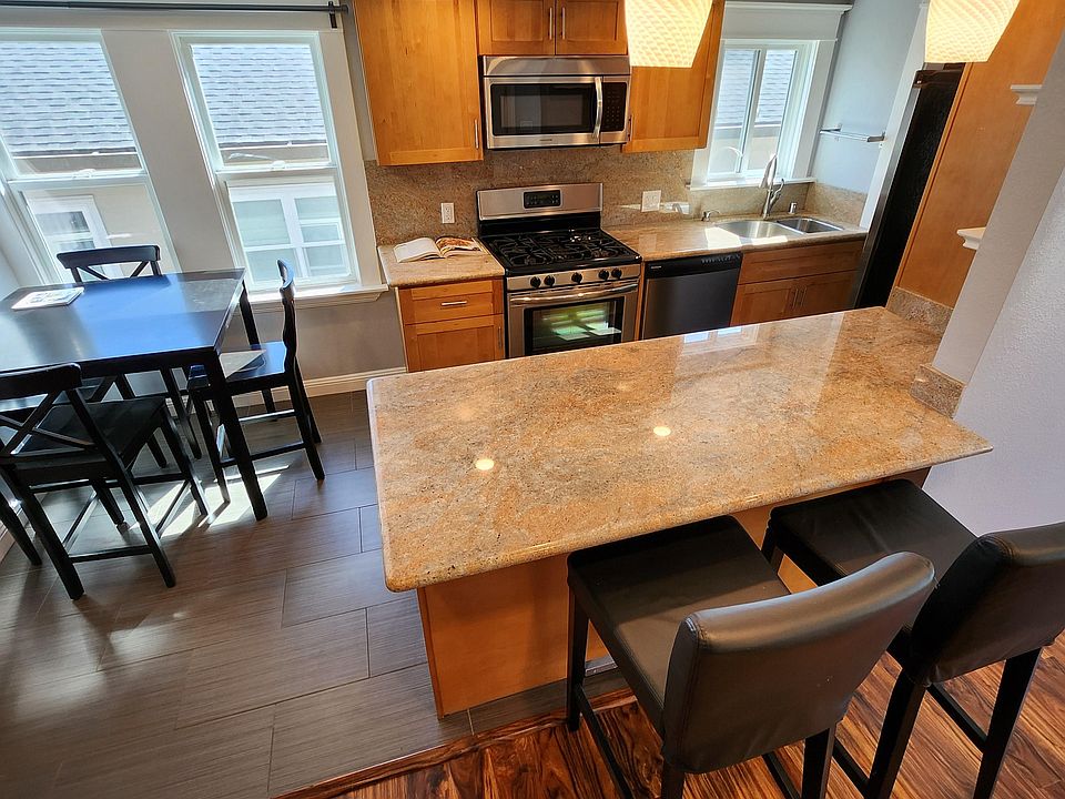 Eat-in-kitchen, open floor plan to living room