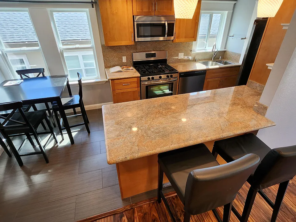 Eat-in-kitchen, open floor plan to living room